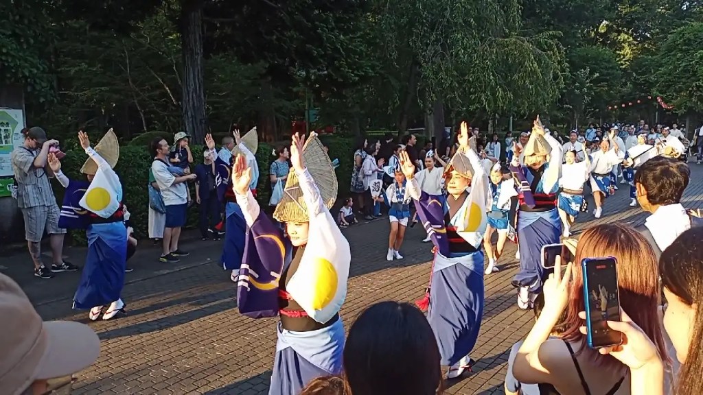 A procession of musicians and traditional dancers going past at the Edo Tatemono Museum.