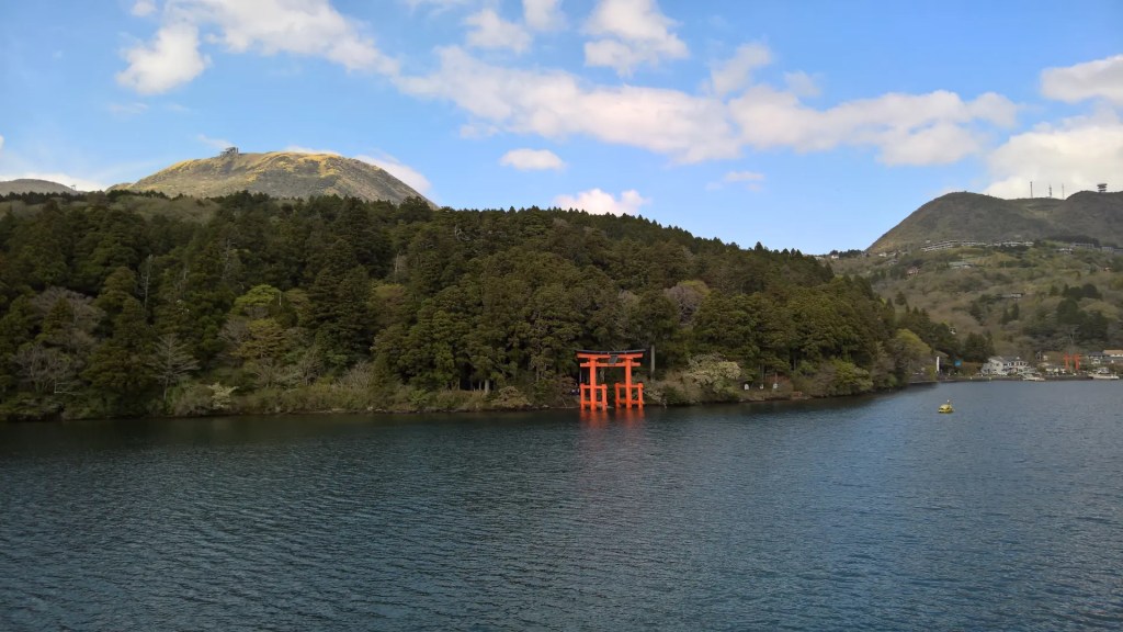 The torii gate as seen from the boat on the lake Ashino,